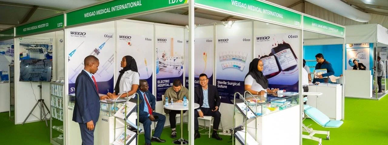 Exhibitors and attendees at a Weigao Medical International stand at World Health Expo Nairobi